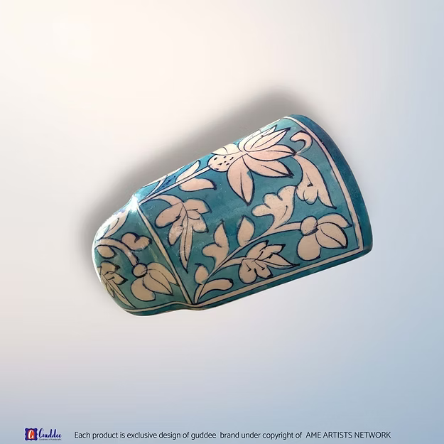 Aasmani blue blue pottery wall planter pot showing the vibrant sky-blue hand-painted floral motifs by Guddee.