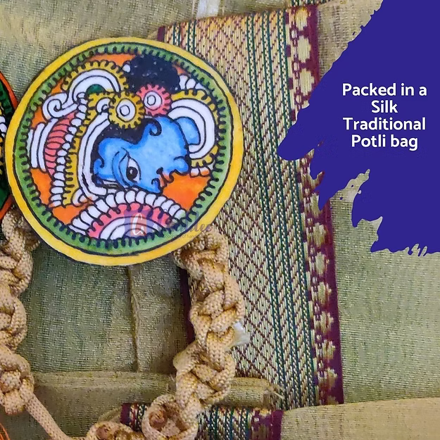 Close-up of the intricate artisan carving of Lord Krishna on premium eco-friendly synthetic leather festive rakhi thread.