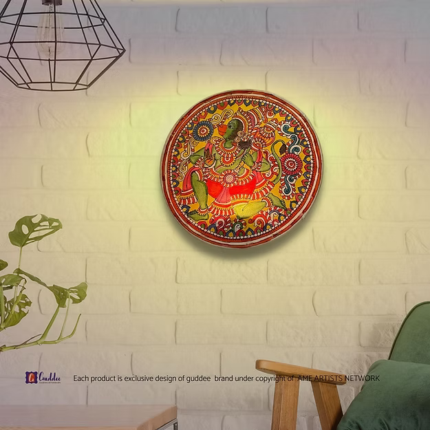A lit synthetic leather Hanuman silhouette tea light holder sitting as a modern decorative centerpiece on a pooja room table