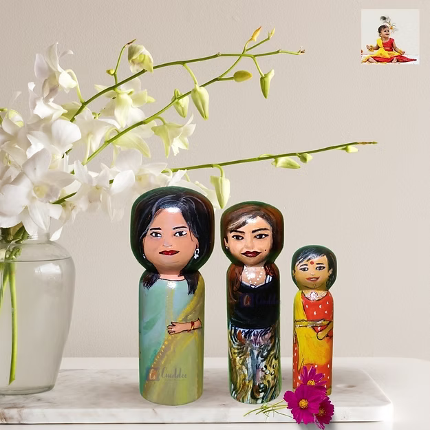 A custom 3-pack personalized wooden family doll set displayed beautifully as minimalist nursery shelf home decor.