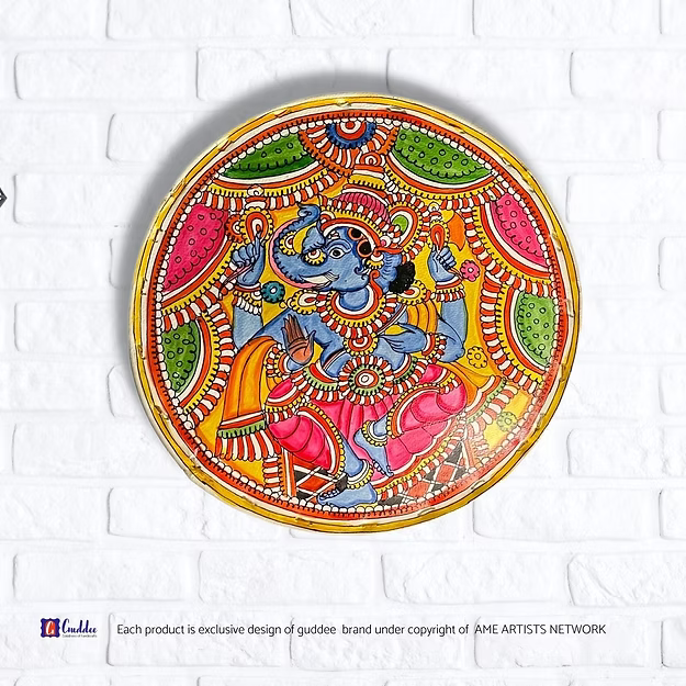 Circle Ganesha faux leather Tholu Bommalata wall decor tea light holder showing the rich hand-painted details by Guddee.
