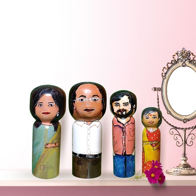 Set of 4 personalized wood dolls hand-painted to look like a family of four from a custom family portrait photo.