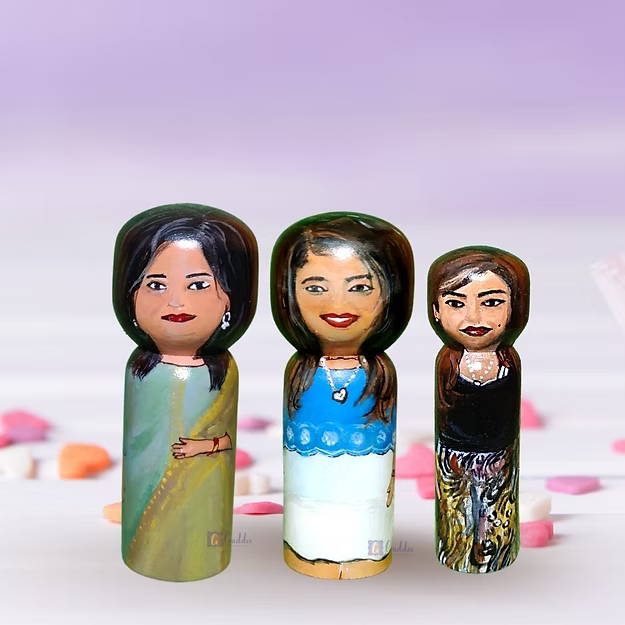 A custom 3-pack personalized wooden family doll set displayed beautifully as minimalist nursery shelf home decor.