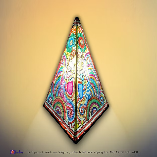 A lit triangular synthetic leather peacock silhouette lamp casting a warm ambient glow as a decorative table centerpiece.
