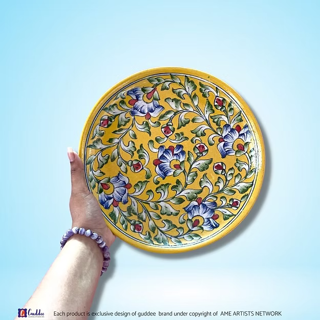 Floral Hues Yellow decorative wall plate showing the vibrant hand-painted mustard and gold flower patterns by Guddee.