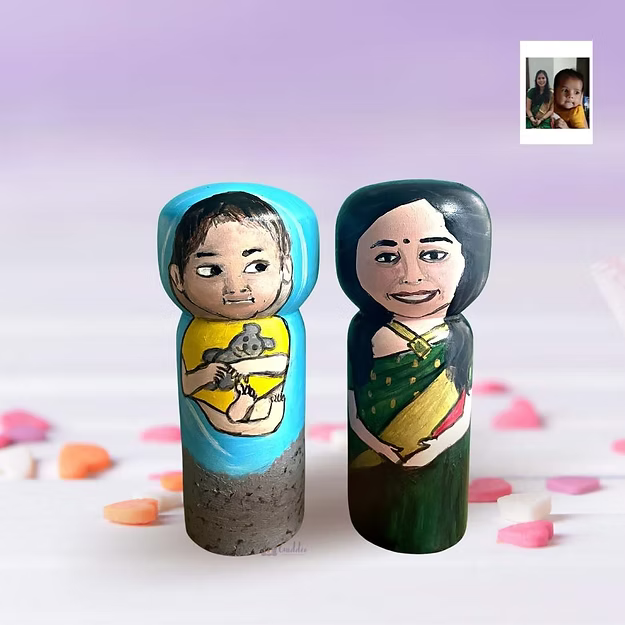Parent-baby personalized wood hand painted doll set showing the custom clothing and photo-matched details by Guddee