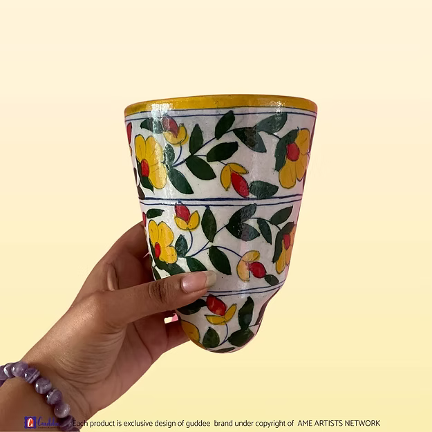 Masti Yellow blue pottery wall planter pot showing the vibrant yellow hand-painted floral motifs by Guddee.