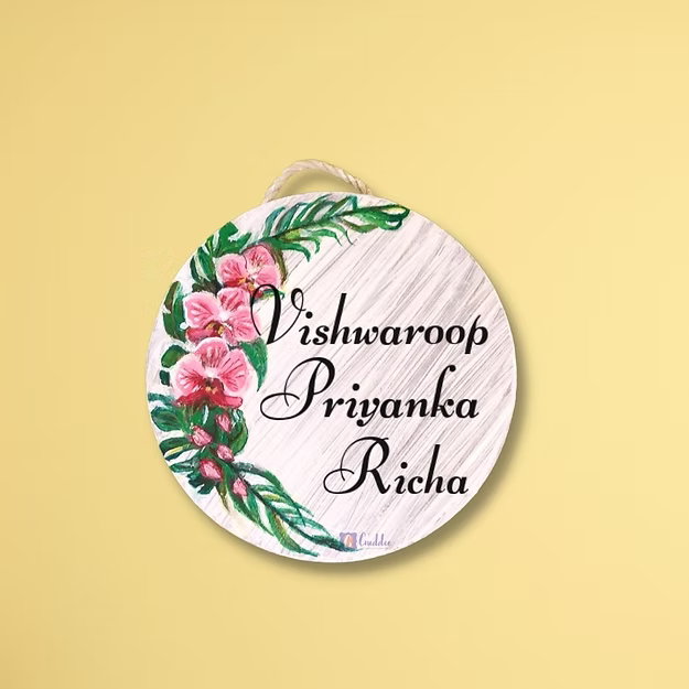 Close-up of the crisp custom text typography and high-definition orchid floral print details on Guddee's house sign.