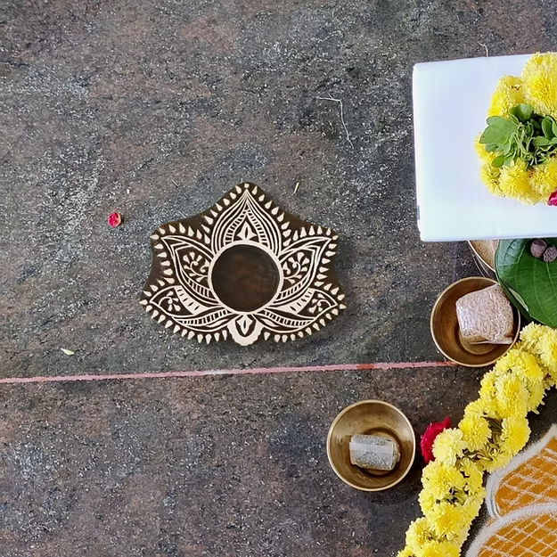 Lotus Sheesham wood tea light holder showing the detailed hand-carved rosewood petals and finish by Guddee.