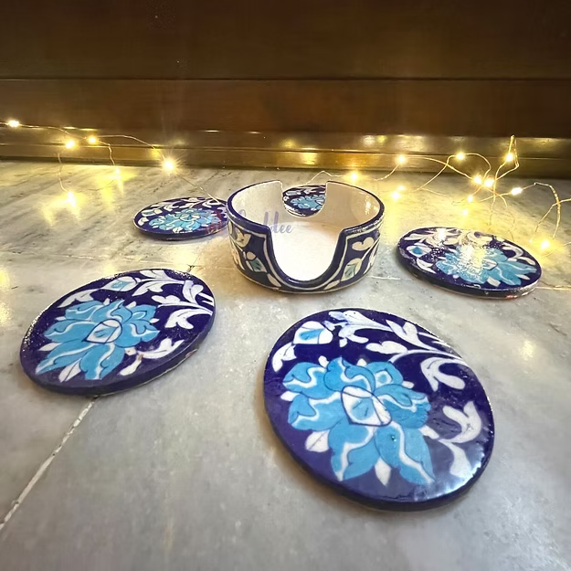 Blue pottery dark blue coaster set of 5 with holder showing the hand-painted traditional motifs by Guddee.