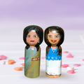 Parent-baby personalized wood hand painted doll set showing the custom clothing and photo-matched details by Guddee