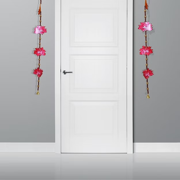 Symmetrical vertical synthetic leather lotus hanging panels styled beautifully on either side of a traditional home doorway.