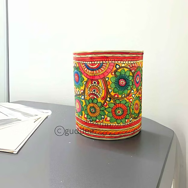 Close-up of the intricate floral silhouette cutouts on Guddee's heat-resistant half cylinder faux leather candle stand.