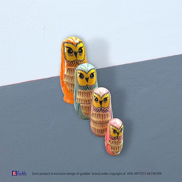 Set of 4 owl nesting dolls showing the hand-painted pine wood character details in sequence by Guddee.