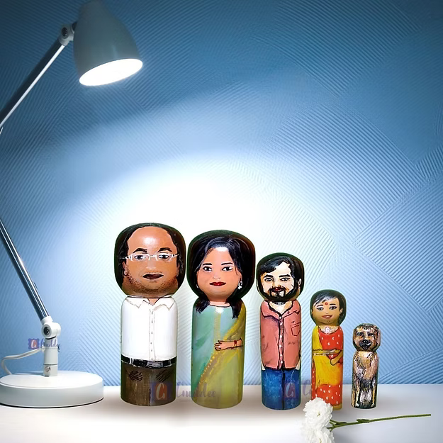 Set of 5 personalized wood dolls hand-painted to look like a family of five from a custom family portrait photo.