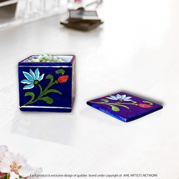 Mini lotus storage blue pottery box showing the hand-painted traditional lotus flower design and lid by Guddee.