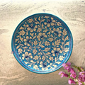 Light blue handcrafted Jaipur blue pottery wall plate featuring traditional hand-painted floral art mounted as home decor.