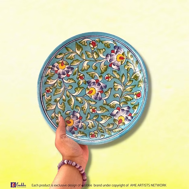 Floral Hues Blue decorative wall plate showing the vibrant hand-painted cobalt and turquoise flower patterns by Guddee.