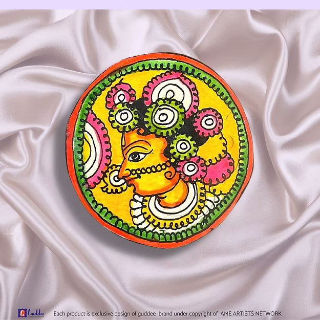 Synthetic leather brooch cum fridge magnet Radha showing the vibrant traditional Tholu Bommalata paint artwork by Guddee.