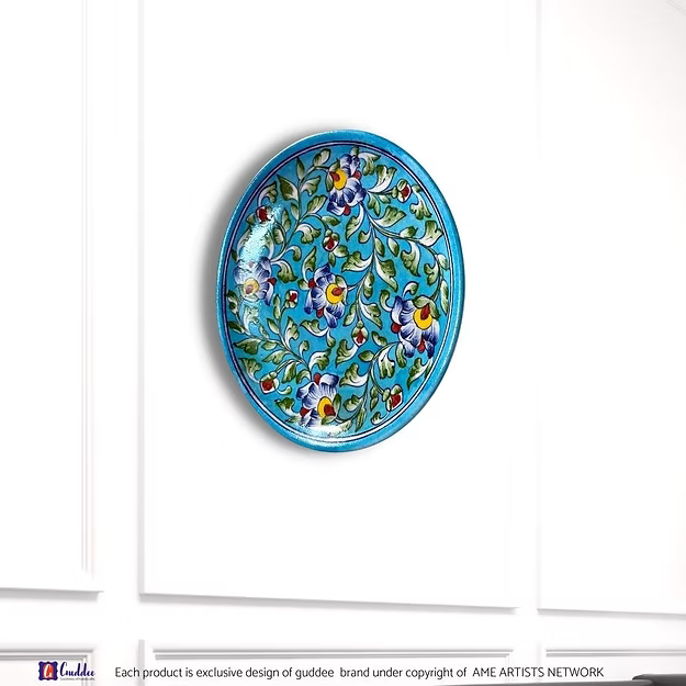 Floral Hues Blue decorative wall plate showing the vibrant hand-painted cobalt and turquoise flower patterns by Guddee.