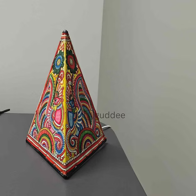 Peacock triangle-shaped synthetic leather wall decor lamp showing the clean geometric cutout lines by Guddee.