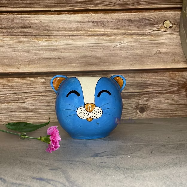 Blue cat handcrafted Jaipur blue pottery animal pot featuring traditional hand-painted floral motifs.