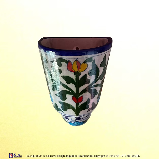 Close-up of the brilliant colorful glaze and intricate traditional floral brush patterns on an authentic clay-free quartz planter.