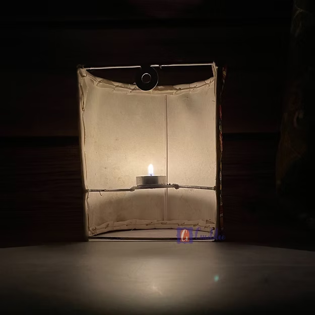 Half cylinder faux leather wall candle sconce by Guddee featuring elegant hand-cut floral tea light accents.