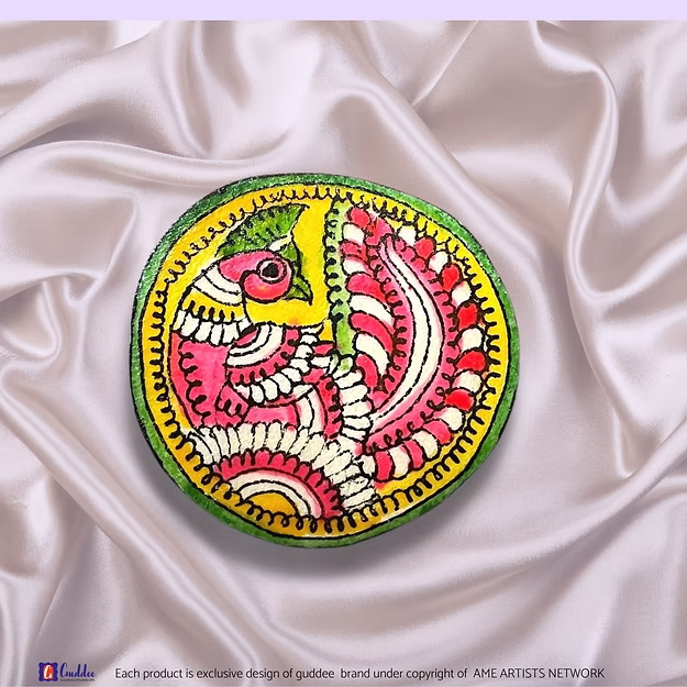 Synthetic leather brooch cum fridge magnet Peacock showing the vibrant traditional Tholu Bommalata paint artwork by Guddee.