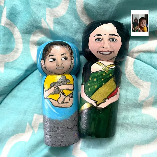 Parent-baby personalized wood hand painted doll set showing the custom clothing and photo-matched details by Guddee