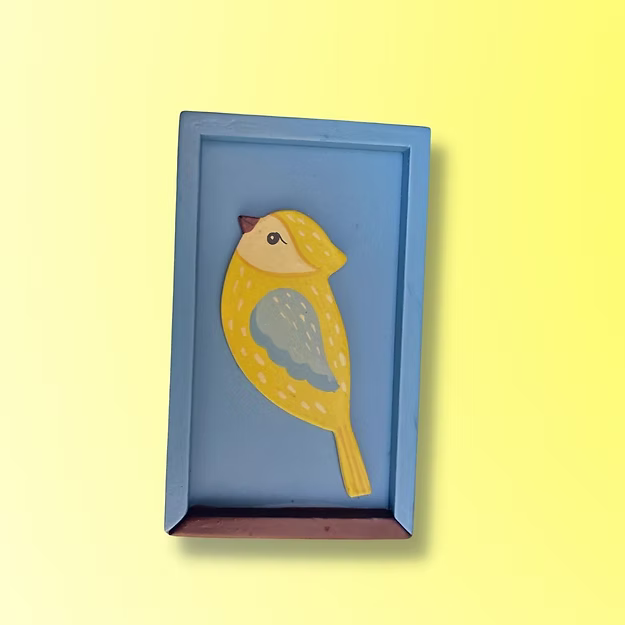 Close-up of the fluid mechanical slider lid track and the vibrant glossy finish on Guddee's small bird storage chest.
