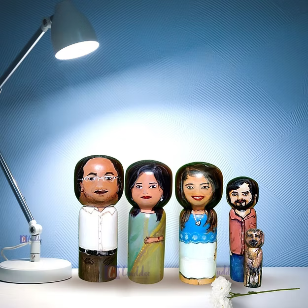 Set of 5 personalized wood dolls hand-painted to look like a family of five from a custom family portrait photo.