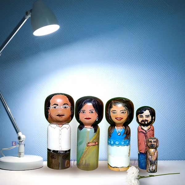 Set of 5 personalized wood dolls hand-painted to look like a family of five from a custom family portrait photo.