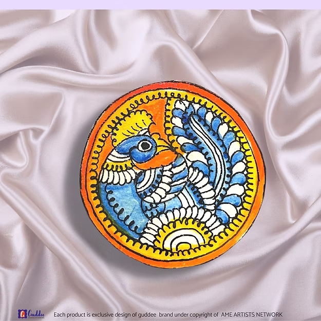 Synthetic leather brooch cum fridge magnet Blue Peacock showing the traditional Tholu Bommalata paint artwork by Guddee.