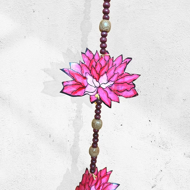 Close-up of the clean precision-cut lotus and lily pad silhouette detailing on Guddee's premium synthetic leather hanging art.