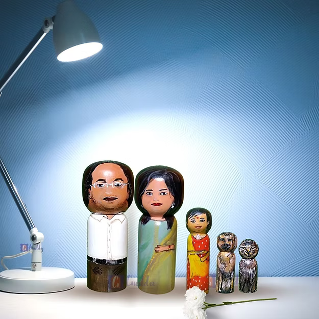 Set of 5 personalized wood dolls hand-painted to look like a family of five from a custom family portrait photo.
