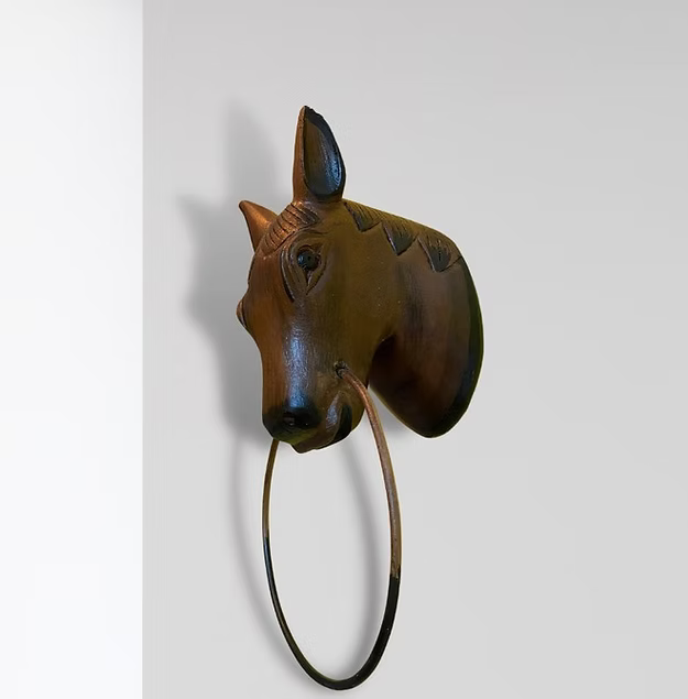 Handcrafted wooden horse wall decor and cloth hanger showing the detailed hand-carved finish and pegs by Guddee.