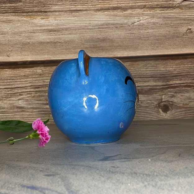 Blue cat handcrafted Jaipur blue pottery animal pot featuring traditional hand-painted floral motifs.