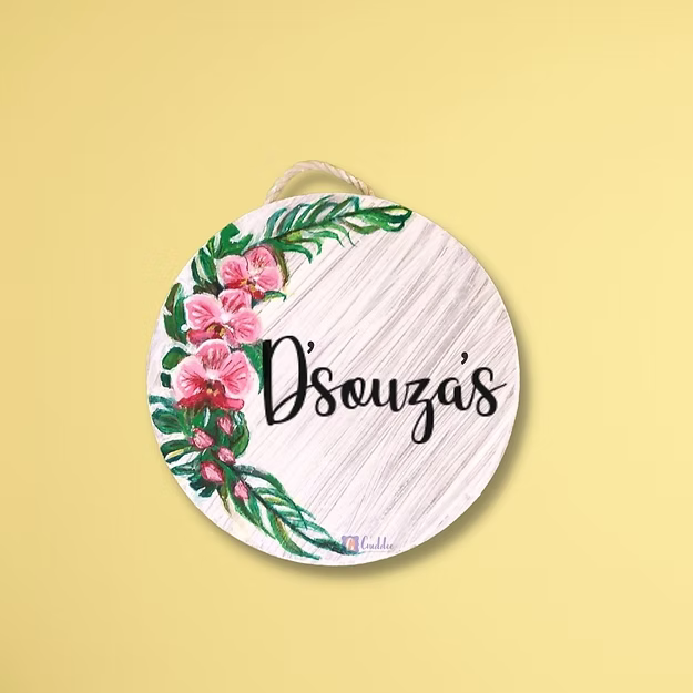 An elegant personalized orchid house name plate presented beautifully as a premium housewarming gift for new homeowners.